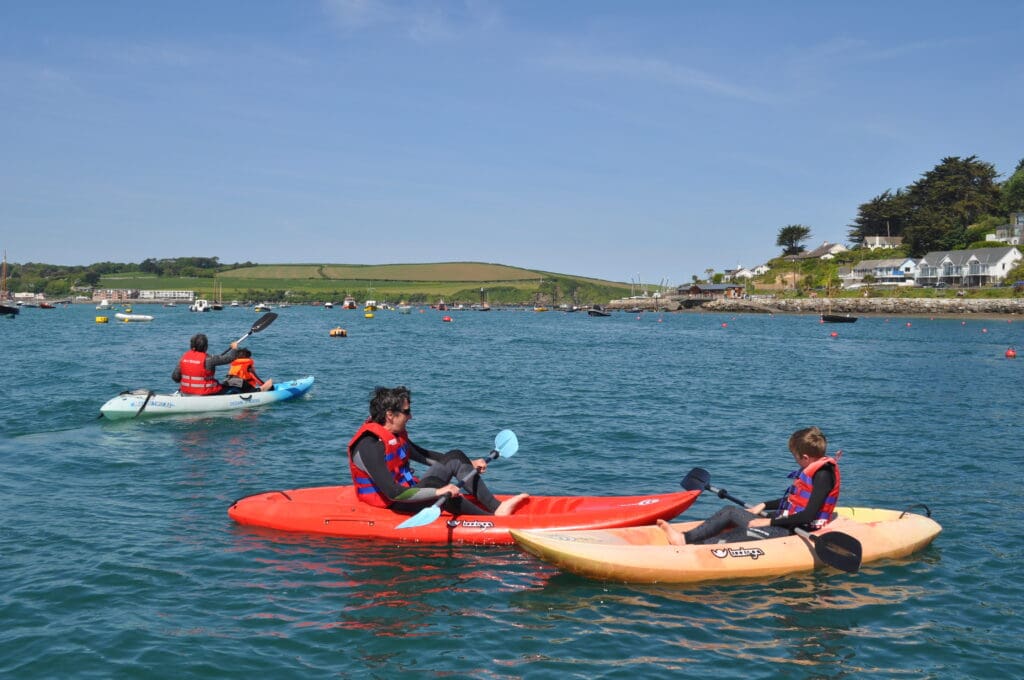 customers kayaking on the camel estuary with camel ski school in sunny weather